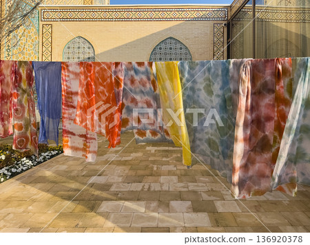 Row of colorful clothes hanging on a line. Samarkand 136920378