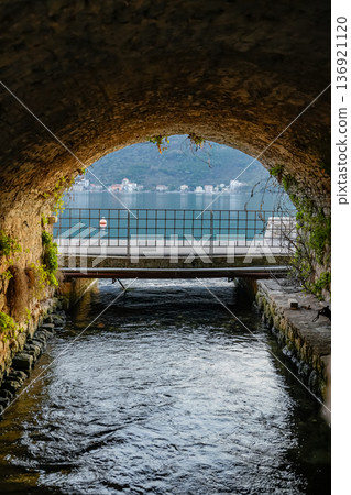 View from Stone Tunnel to River Flowing into Sea and Bridge View from Stone Tunnel to River Flowing into Sea and Bridge 136921120
