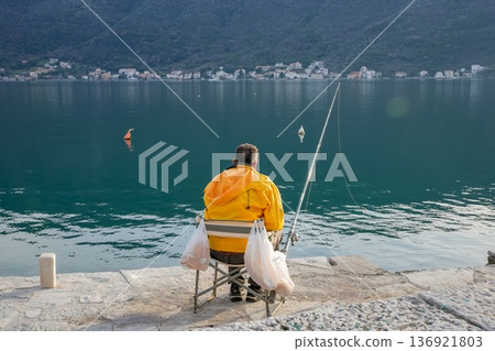 Man Fishing in the Sea 136921803