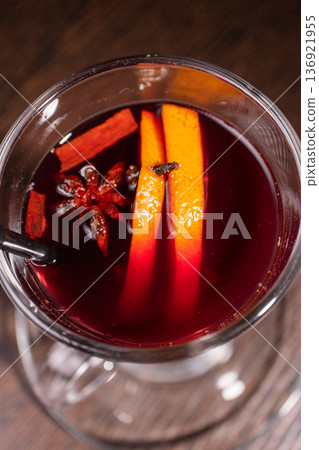 Mulled wine in a glass on a wooden table Mulled wine in a glass on a wooden table 136921955
