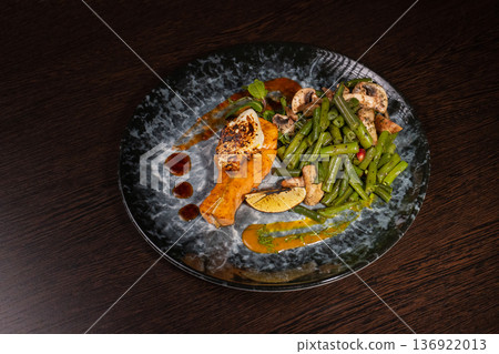 Fried salmon with vegetables and mushrooms Fried salmon with vegetables and mushrooms 136922013