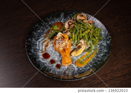 Fried salmon with vegetables and mushrooms 136922015