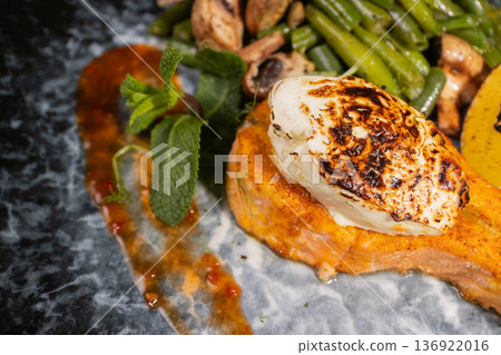 Fried salmon with vegetables and mushrooms Fried salmon with vegetables and mushrooms 136922016