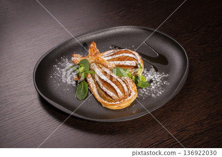 Dessert of fried pear sprinkled with powdered Dessert of fried pear sprinkled with powdered 136922030