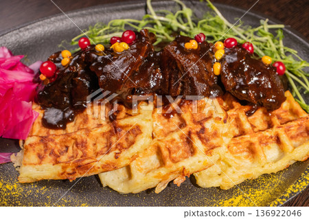 Fried meat with potato waffles and herbs on a Fried meat with potato waffles and herbs on a 136922046