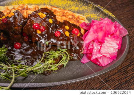 Fried meat with potato waffles and herbs on a Fried meat with potato waffles and herbs on a 136922054