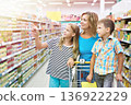 Family chooses products in shop 136922229