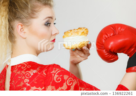 Woman boxing cream cupcake 136922261