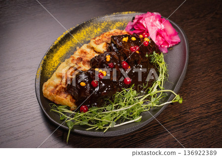 Fried meat with potato waffles and herbs on a Fried meat with potato waffles and herbs on a 136922389