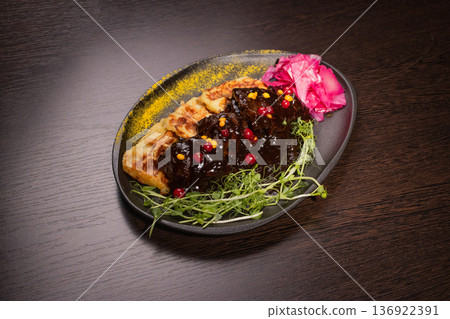 Fried meat with potato waffles and herbs on a Fried meat with potato waffles and herbs on a 136922391