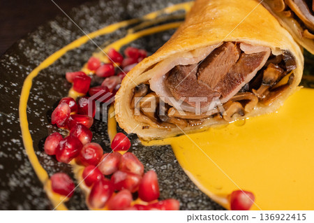 Pancakes with meat filling and sauce Pancakes with meat filling and sauce 136922415