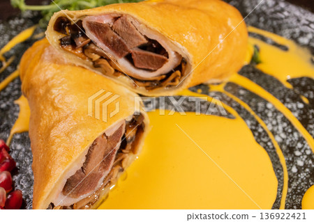 Pancakes with meat filling and sauce Pancakes with meat filling and sauce 136922421