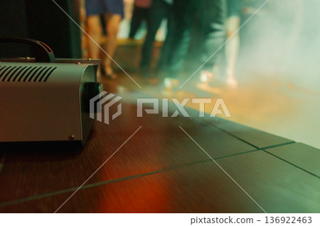 Smoke comes out of a smoke machine at a restaurant 136922463