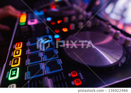 A DJ booth in the evening lights of a club A DJ booth in the evening lights of a club 136922466