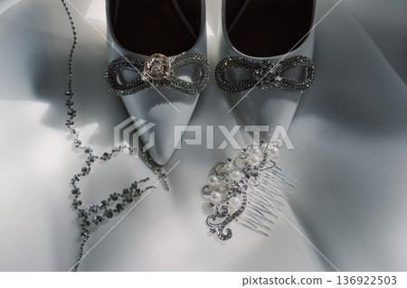 Wedding gold rings on the bride's shoes Wedding gold rings on the bride's shoes 136922503