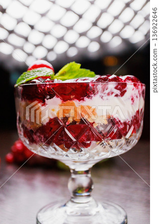 Dessert of pickled cherries with cream in a glass Dessert of pickled cherries with cream in a glass 136922646