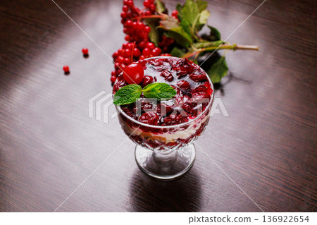 Dessert of pickled cherries with cream in a glass Dessert of pickled cherries with cream in a glass 136922654