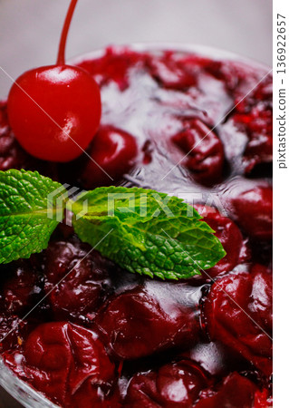 Dessert of pickled cherries with cream in a glass Dessert of pickled cherries with cream in a glass 136922657