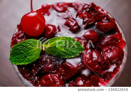 Dessert of pickled cherries with cream in a glass Dessert of pickled cherries with cream in a glass 136922658