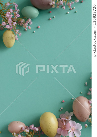 Pastel Easter Eggs and Flowers on Teal Background. Festive Spring Flatlay Pastel Easter Eggs and Flowers on Teal Background. Festive Spring Flatlay 136922720