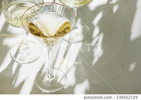 Several Champagne Glasses on White Background. Birthday or Wedding Celebration Arrangement Several Champagne Glasses on White Background. Birthday or Wedding Celebration Arrangement 136922729