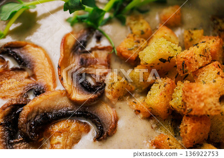 Cream soup with mushrooms and herbs in a black Cream soup with mushrooms and herbs in a black 136922753
