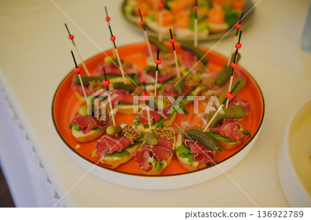 Appetizers on skewers with cold meats Appetizers on skewers with cold meats 136922789