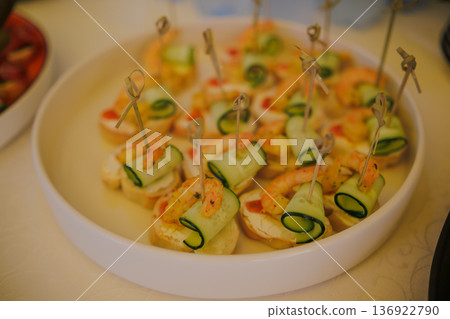 Appetizers on skewers with shrimp 136922790