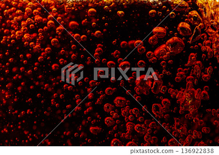 Carbonated drink is poured into a glass. Carbonated drink is poured into a glass. 136922838