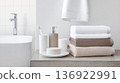 Stack of soft folded towels on marble shelf in modern bathroom, background 136922991