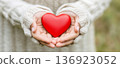 Hands holding red heart symbolizing love and care, Giving Tuesday, Valentine Day concept banner with copy space 136923052