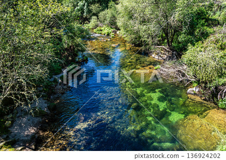The River Caldo in Nationalpark Peneda-Geres in Portugal The River Caldo in Nationalpark Peneda-Geres in Portugal 136924202