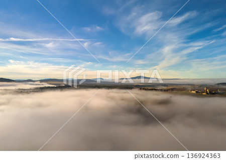 Aerial view of foggy landscape with Klet mountain in South Bohemia, Czech Republic Aerial view of foggy landscape with Klet mountain in South Bohemia, Czech Republic 136924363