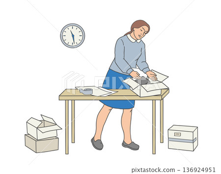 Woman placing item into open box on the table Woman placing item into open box on the table 136924951