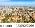 Modern residential areas and office buildings with Tonle Sap river in the background in rapidly developing Phnom Penh city panorama, Cambodia 136925366