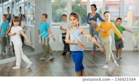 Group of children dancing contemporary dance 136925384
