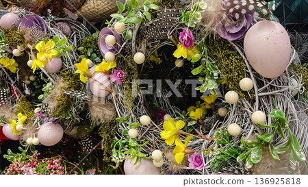 Beautiful Easter wreaths with spring flowers, speckled eggs and feathers, festive holiday decor. Beautiful Easter wreaths with spring flowers, speckled eggs and feathers, festive holiday decor. 136925818