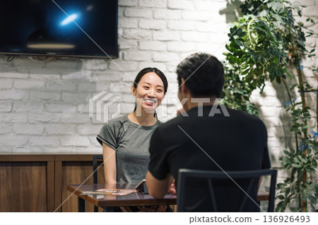 Women listening at a table in the gym Women listening at a table in the gym 136926493
