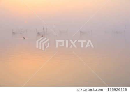 Misty landscape at sunrise Misty landscape at sunrise 136926526
