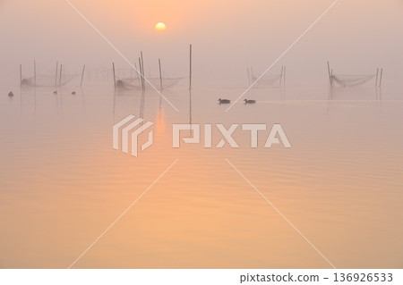 Misty landscape at sunrise Misty landscape at sunrise 136926533