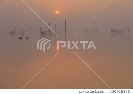 Misty landscape at sunrise Misty landscape at sunrise 136926536