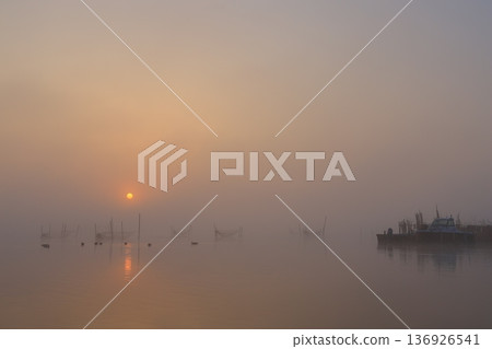 Misty landscape at sunrise 136926541