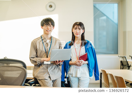 Portrait of young men and women working in the office Portrait of young men and women working in the office 136926572