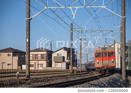 Tobu Railway 8000 series (8111F) train running through a residential area 136926608