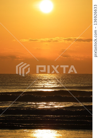 A sea stained in a morning glow A sea stained in a morning glow 136926633