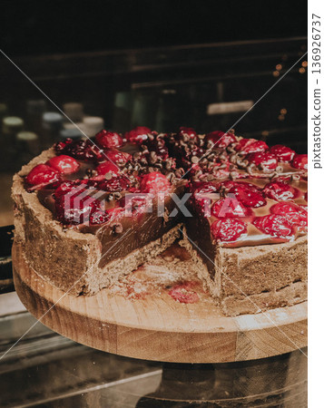 Chocolate cherry cake on wooden stand Chocolate cherry cake on wooden stand 136926737