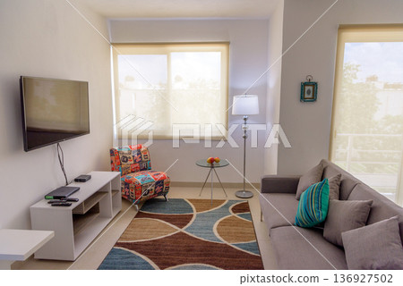 Cozy living room interior with wall mounted television Cozy living room interior with wall mounted television 136927502