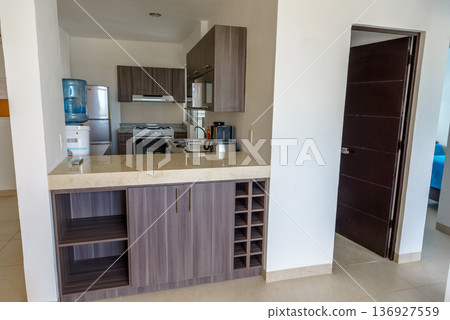 Modern kitchen with breakfast bar and cabinets Modern kitchen with breakfast bar and cabinets 136927559