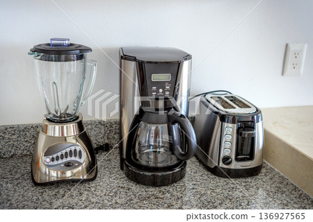 Kitchen counter with blender coffeemaker and toaster appliances Kitchen counter with blender coffeemaker and toaster appliances 136927565
