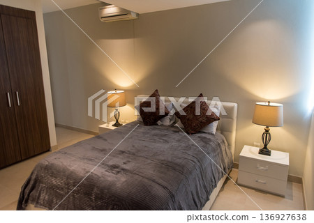 Cozy bedroom lighting with bedside table lamps Cozy bedroom lighting with bedside table lamps 136927638